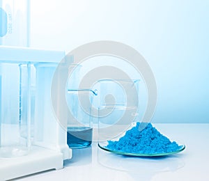 Closeup inorganic chemical on white laboratory table. CopperII sulfate, alcohol. Chemical ingredient for Cosmetics and