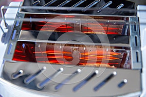 Closeup inside bread toaster heating element