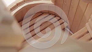 Closeup of interior of cedar phytobarrel with wooden grates for feet and sitting