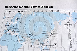 Closeup International time zone on white paper.
