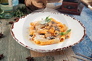 Rigatoni pasta putanesca with olives anchovies photo
