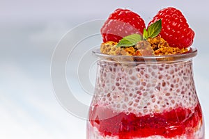 Closeup of jar with chia and raspberry pudding