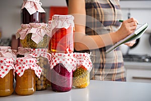 Closeup on jars with homemade fruits jam