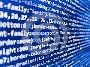 Closeup of Java Script, CSS and HTML. Blue purple violet color. Software developer programming code on black screen. Developer