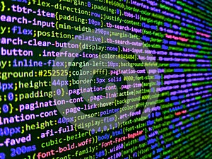 Closeup of Java Script and HTML code. Big data and Internet of things trend. Simple website HTML code with colorful tags in