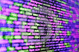 Closeup of Java Script and HTML code. Data encryption security code on a computer display, close up. Abstract computer script