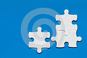 Closeup of jigsaw puzzle isolated. Missing jigsaw puzzle piece, business concept for completing the puzzle piece. Group of puzzle