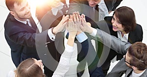 Closeup. joyful business team with folded hands together