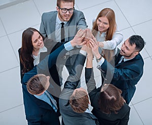 Closeup. joyful business team with folded hands together