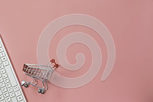 Closeup keyboard with shopping cart for business,e-commerce concept