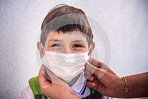 Closeup Kid face wearing protective face mask for pollution or virus, Cropped shot of school boy wearing protection mask against