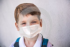 Closeup Kid face wearing protective face mask for pollution or virus, Cropped shot of school boy wearing protection mask against