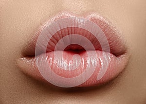 Closeup kiss natural lip makeup. Beautiful plump full lips on female face. Clean skin, fresh make-up. Spa tender lips photo