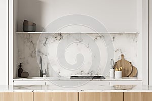 Closeup kitchen cooking area with marble splashback