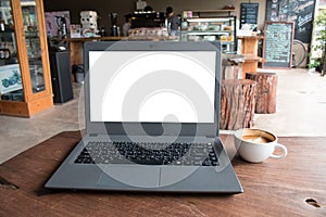 Closeup of laptop computer with blank display in coffee shop concept image made advertised product. photo