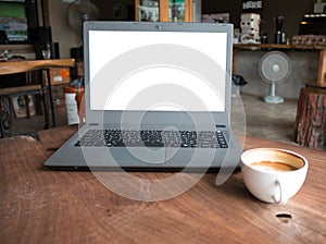 Closeup of laptop computer with blank display in coffee shop concept image made advertised product. photo