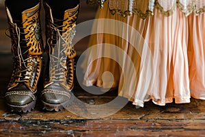 closeup of laceup boots beside a flapperstyle dress photo