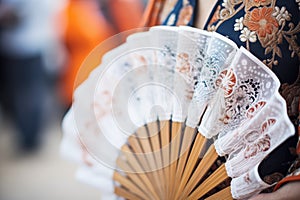 closeup on lacework of a dancers traditional fan photo