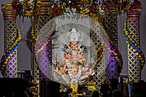 Closeup , landscape view of decorated and garlanded Isolated idol of Hindu God Panchmukhi Ganesha in Pune ,Maharashtra, India.