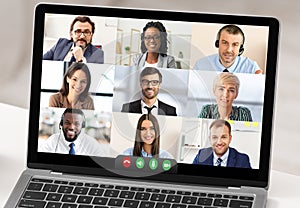 Closeup Of Laptop Screen With Business People Having Online Meeting