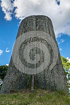 Closeup of a large rune stone from a low angle perspective