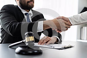 Closeup lawyer colleagues or legal team handshake. Equilibrium