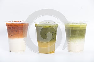 Closeup of layered drinks iced tea group thai milk tea matcha latte and yuzu green tea in plastic glass isolated white background