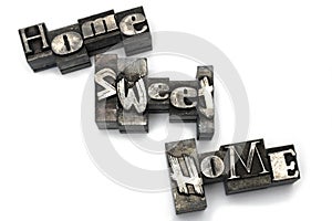 Closeup lead letters home sweet white background