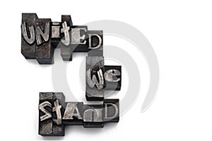 closeup lead letters united we stand white background