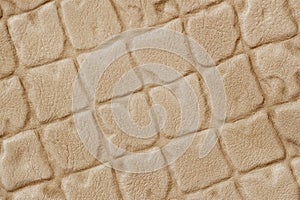 Closeup on leather texture surface with diagonal squre stamped pattern. Modern background