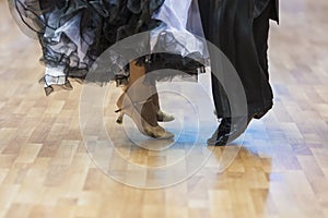 Closeup of Legs of the Professional Dance Couple Performing Euro