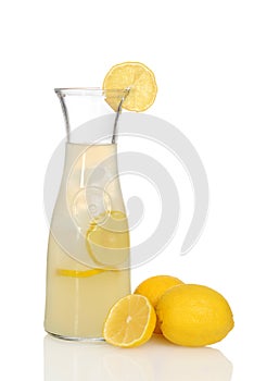Closeup lemonade in pitcher with lemons