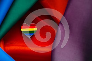 Closeup of LGTBI pin heart shaped. LGBT Pride concept