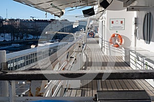 Closeup of a liferaft of a large passeger ferry. An outside walking promeade of a cruise ship