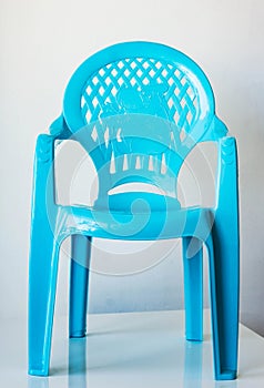 Closeup of light blue child seat. Back holes with the elephant.