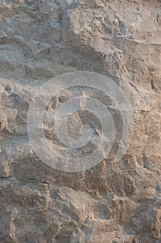 Closeup limestone rock face showing weathered strata Geology walpaper or background