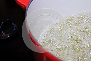 Closeup of liquid boiling in a pot