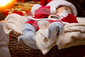 Closeup of little baby Santa feet in blue wool socks