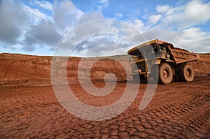 Closeup of a loaded tip-truck in an open mine