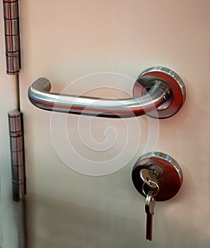 Closeup of lock and key on the door with handle ,safety concept