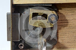 Closeup into a lock mechanism of a lever tumbler lock