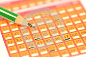 Closeup of lottery ticket and pencil