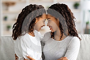 Closeup of loving african american family mother and daughter