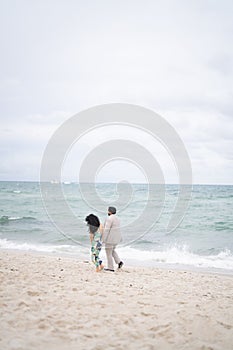 Closeup of a loving couple embracing on a beach, enjoying a romantic moment together