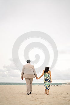 Closeup of a loving couple embracing on a beach, enjoying a romantic moment together