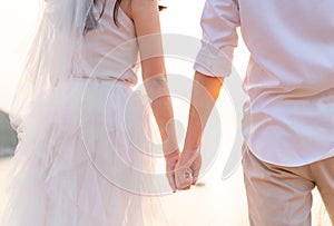 Closeup of loving couple holding hands