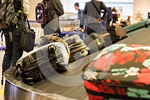 Closeup of luggage bag on airport conveyor belt for pickup