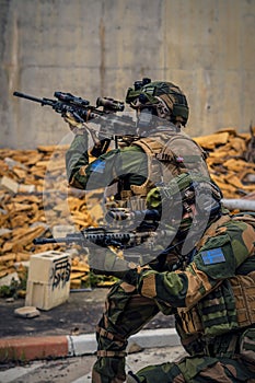 Closeup of lurking special forces soldiers with weapons