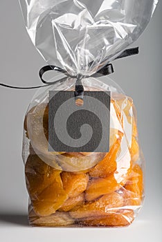 Closeup on luxury bag of candied apricots with blank label