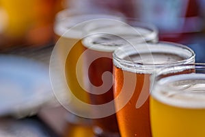 Closeup macro of a beer flight in sunlight